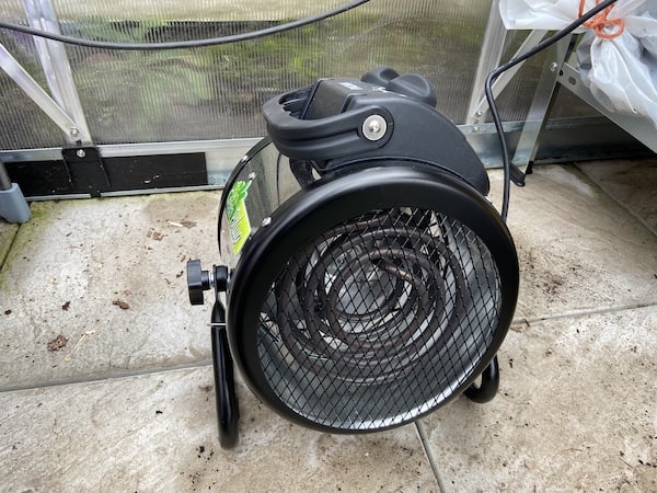 BioGreen Palma Greenhouse heater with digital thermostat being tested