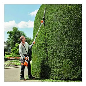 Stihl HLA 85 Cordless Long-Reach Hedge Trimmer in use