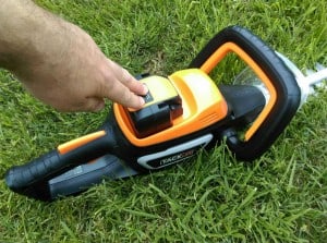 Battery inserted into TackLife Cordless Hedge Trimmer