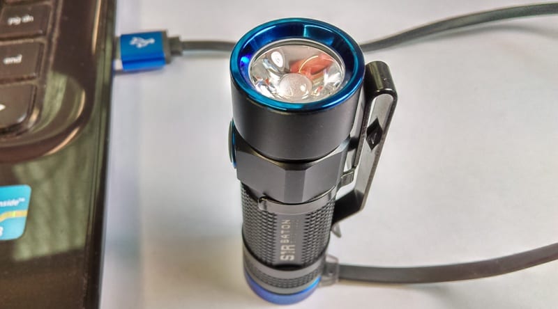 OLIGHT S1R Baton being charged by USB