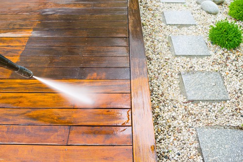 Cleaning decking with a pressure washer