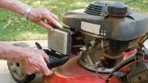 Lawn mower engine being serviced