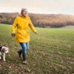Woman walking with dog in a good pair of wellies