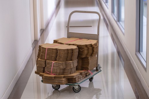 Platform trolley loaded with cardboard