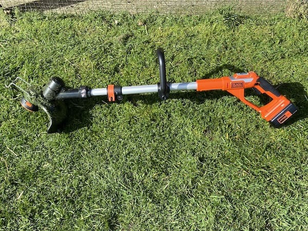 Black + Decker 36c Cordless Strimmer lay on grass