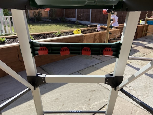 Where the clamping blades are stored on the Bosch PWB 600 Portable Work Bench when not in use