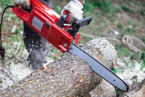 Electric chainsaw being tested