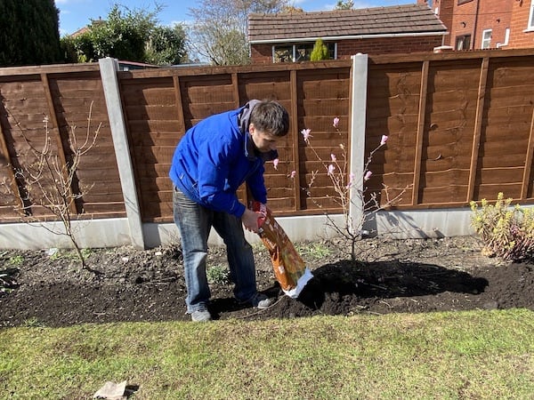 Add topsoil to borders to being soil level to same level as the current lawn