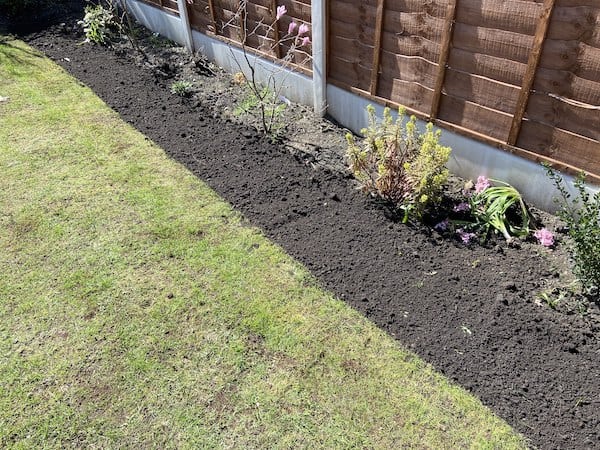 soil now level and lightly raked nearly ready to lay turf on top