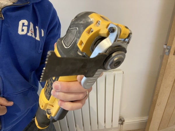 DeWalt DWE315KT Oscillating Multi-Tool with attach fitted at different position for awkward areas