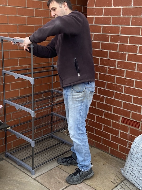 Putting final section of frame together of mini grow house