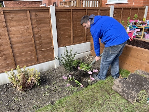 Removing plants from area prior to laying turf