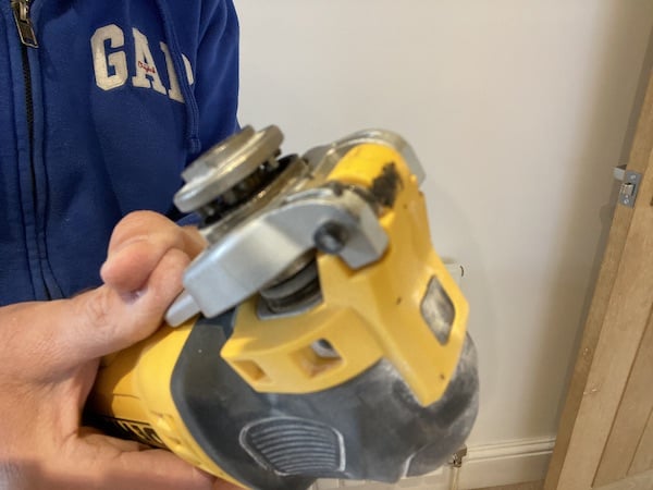 DeWalt DWE315KT Oscillating Multi-Tool in open position for inserting attachment