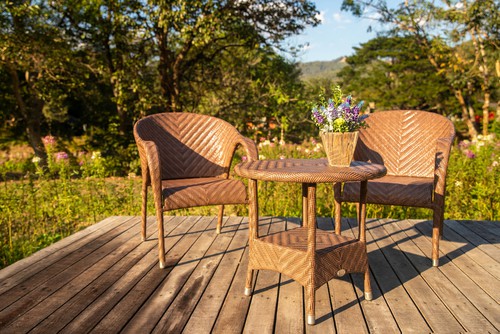 Rattan bistro set in decking, durable and easy to clean and care for