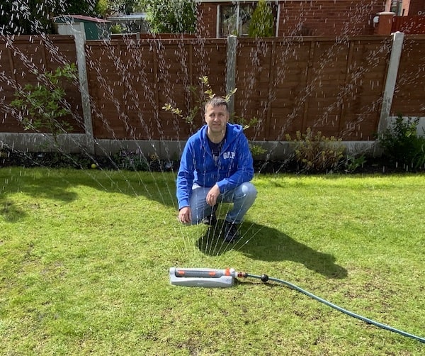 Pro Oscillating Bar Lawn Sprinkler being tested