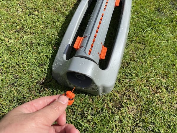 Nozzle cleaner for clearing blocked nozzles on sprinkler