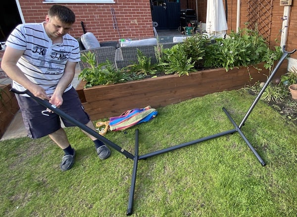 Inserting the screws the hammock will hook onto.