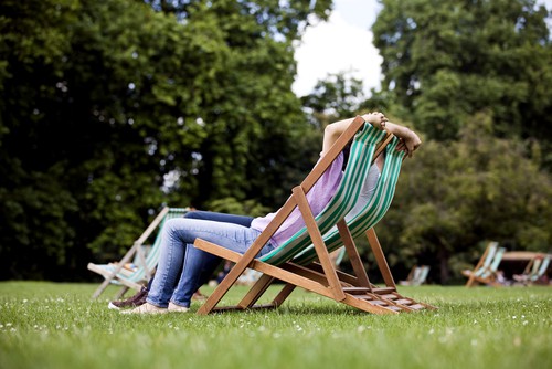 Garden deck chair being used in park as easy to carry