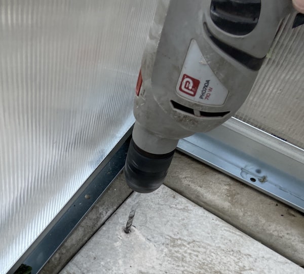 Drilling all 10 holes that I have marked with marker pen ready to insert rawl plugs