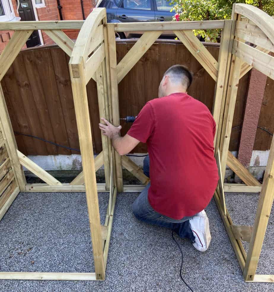 screwing the 3 section of the Rowlinson Triple Bin store together