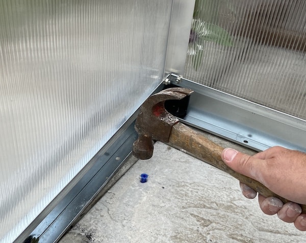 Inserting rawl plugs that I will screw the screw into when securing the base