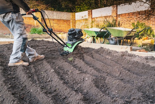 Tiller soil with mini petrol cultivator