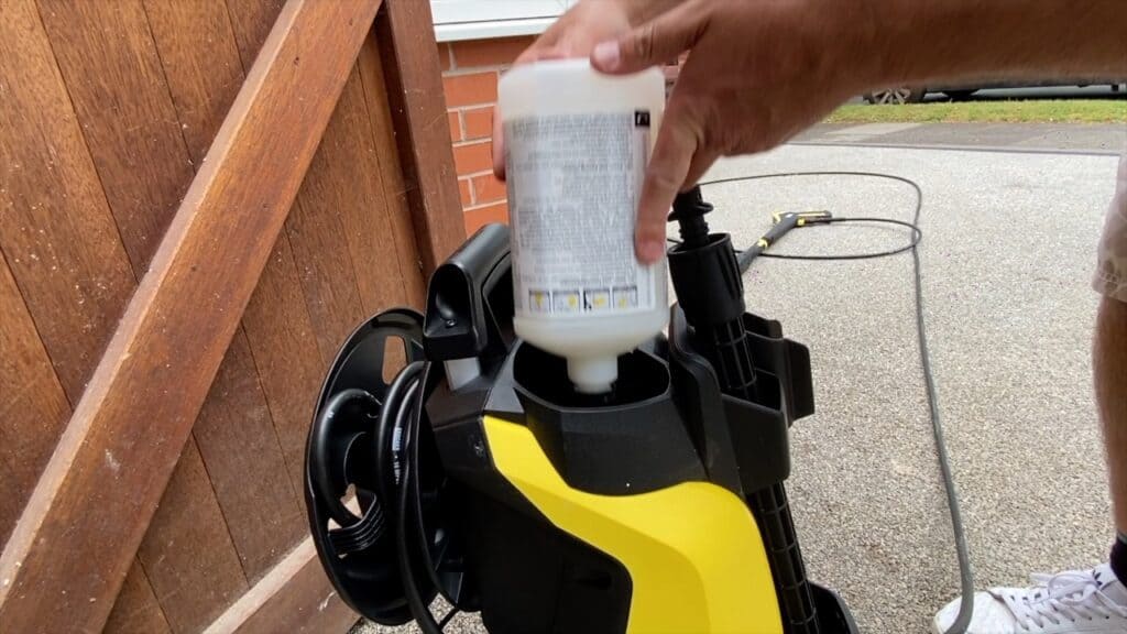 Plug-n-play system which feed deterrent to thee pressure washer - I remove the cap and refill with my own detergent