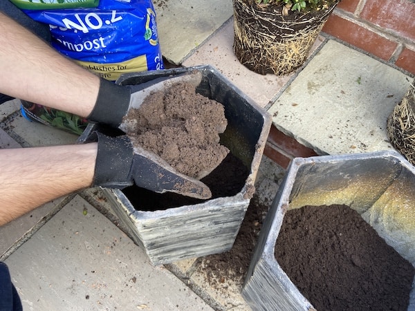Add a layer of potting compost to bottom of posts