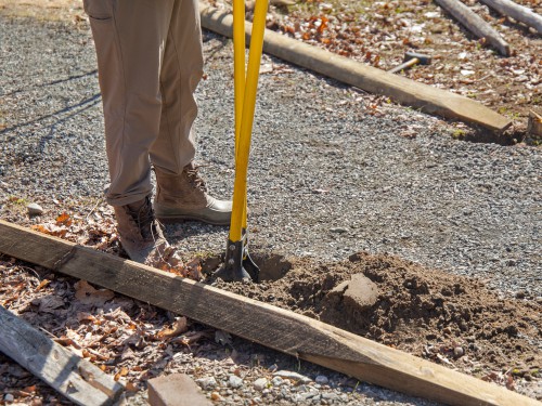 Manual post hole diggers are easy to use put take more effect than petrol and electric but easier than using a spade