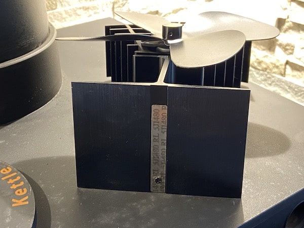 Base of fan with special metal strip that lifts the stove up if it gets to hot