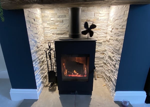 Stove fan being used with wood burning stove