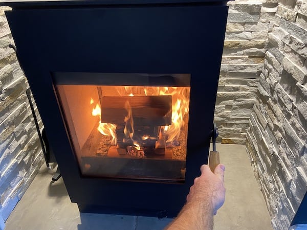 Close door on wood burning stove after 5 minutes once the kindling is burning well