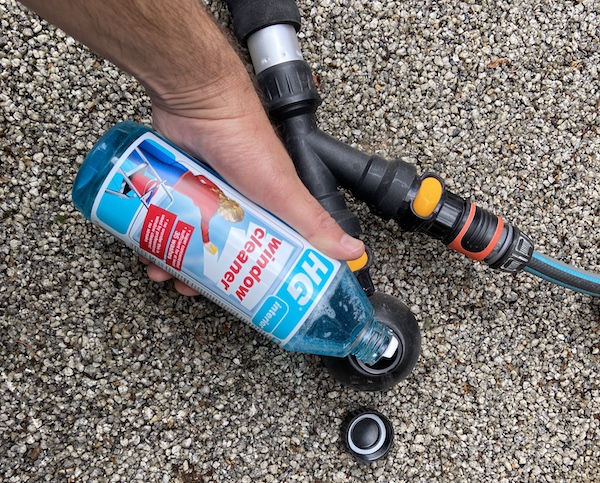 Adding HG super concentrated window cleaner to the soap dispenser