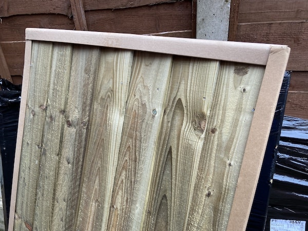 Roof panel wrapped with corner pieces of card to protect roof while in transport