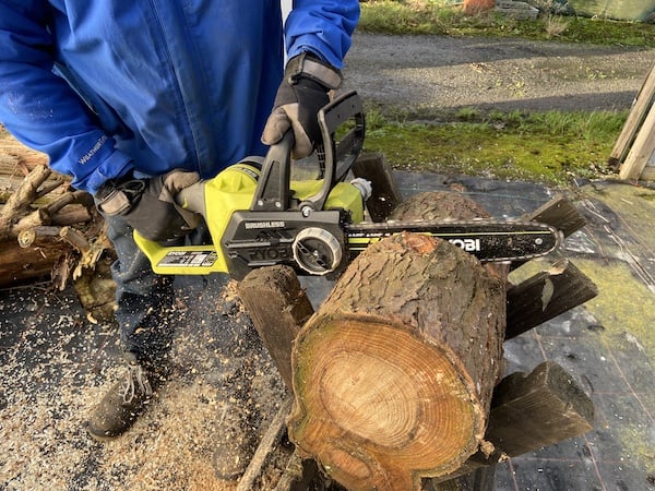 Ryobi cordless chainsaw being tested to see how it compares