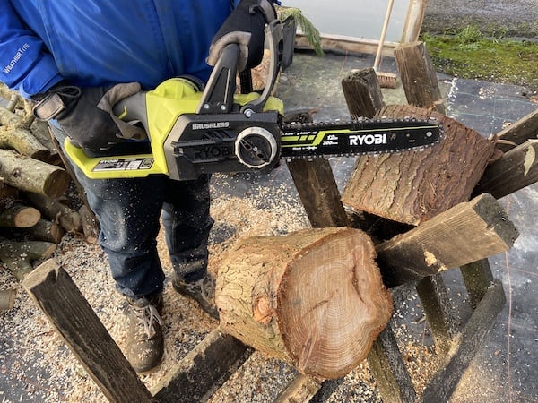 Ryobi electric chainsaw after cutting through large log