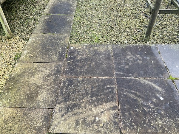 Paving slaps that need cleaning with a surface patio cleaner