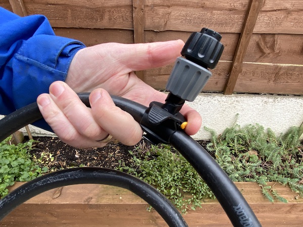 fixing sprinkler in place on flexi pipe