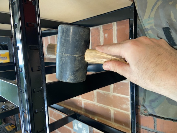 Using a rubber mallet to make sure all the parts are securely inserted