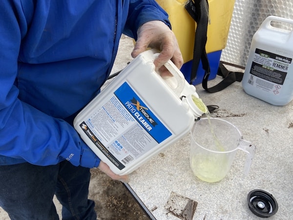 Smartseal Xtreme patio cleaner being mixed into backpack sprayer for testing