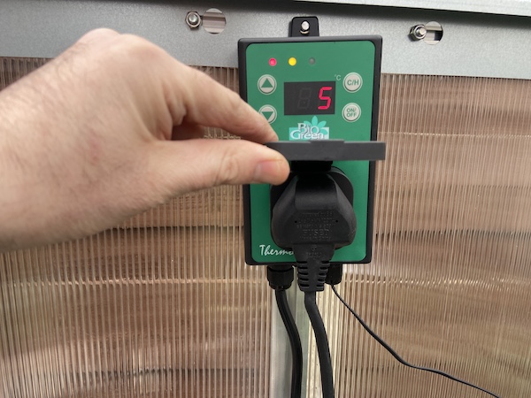 Showing the Palma greenhouse heater plugs directly into the digital thermometer