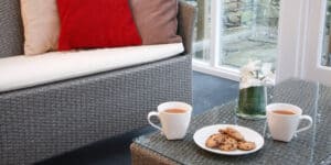 I review different kinds of the best rattan conservatory furniture sets – those with love-seats and matching chairs, those with two armchairs and a table, and those described as bistro sets.