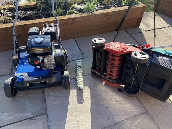 Comparing scarifying blades with steel wire tines for raking