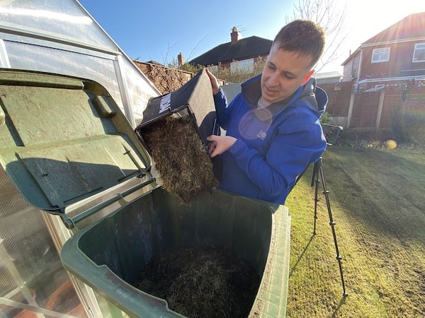 Emptying moss out of large 45 litre collection bag