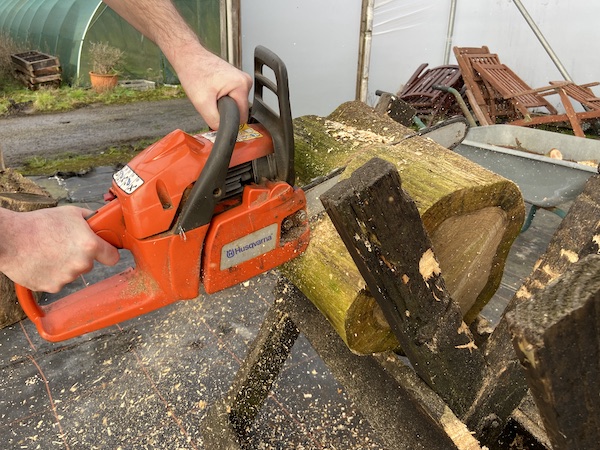 Husqvarna 236 Petrol Chainsaw makes light work of large logs