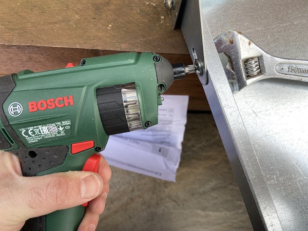 Assembling the Palram Greenhouse Steel Work Bench with a cordless screwdriver and adjustable spanner which really speeds things up