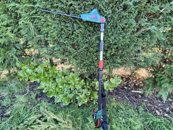 The Bosch Universal HedgePole 18 Long Reach Trimmer head can rotate 90 degrees to trim the top of hedges