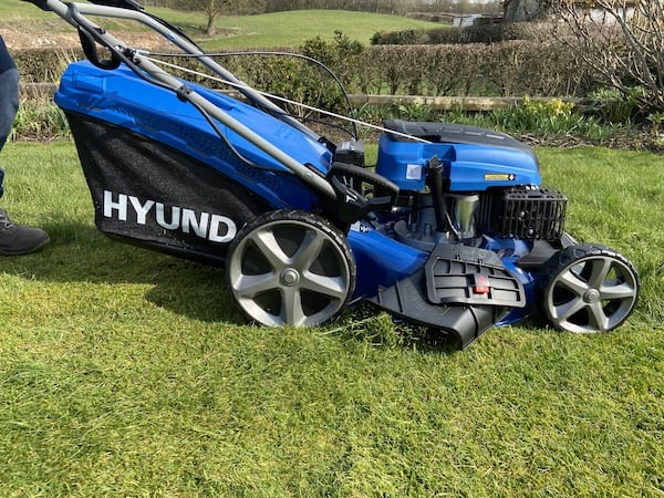 Side chute on lawn mower ejects the grass in a line down the lawn for collecting later, dont use this myself as i always collect the clipping