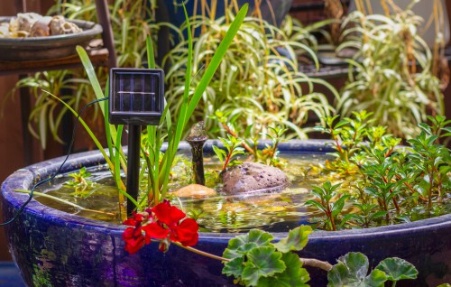 Solar panel that powers water feature and charges the backup battery