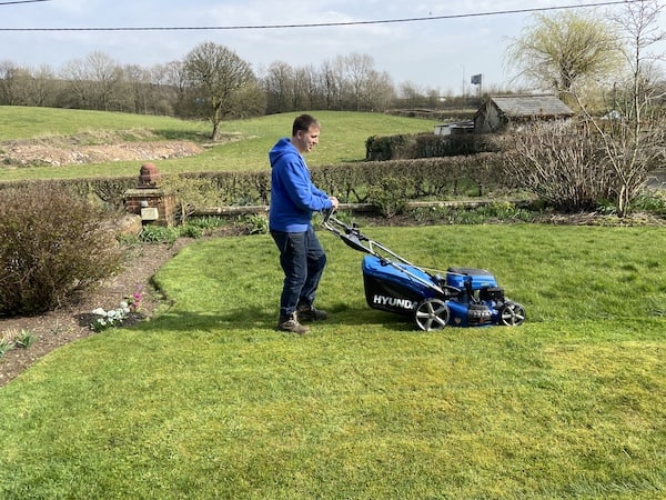 Testing petrol lawn mower to see how it handles a large garden